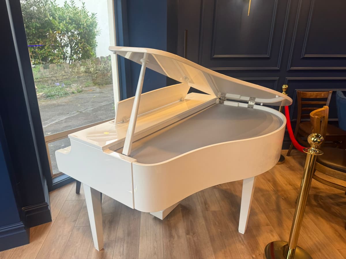 The white grand piano at Black Ivory